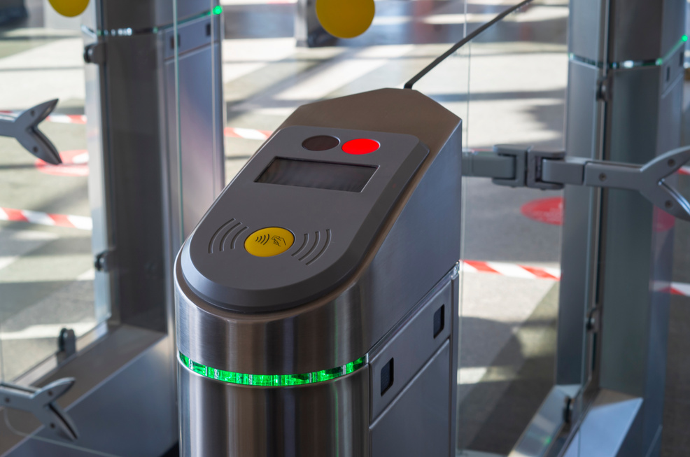 Turnstile for entry and exit with tickets. Closed entrance turnstile with access denied red sign. Security barrier. Business leaders pass through the turnstile of the office gates.